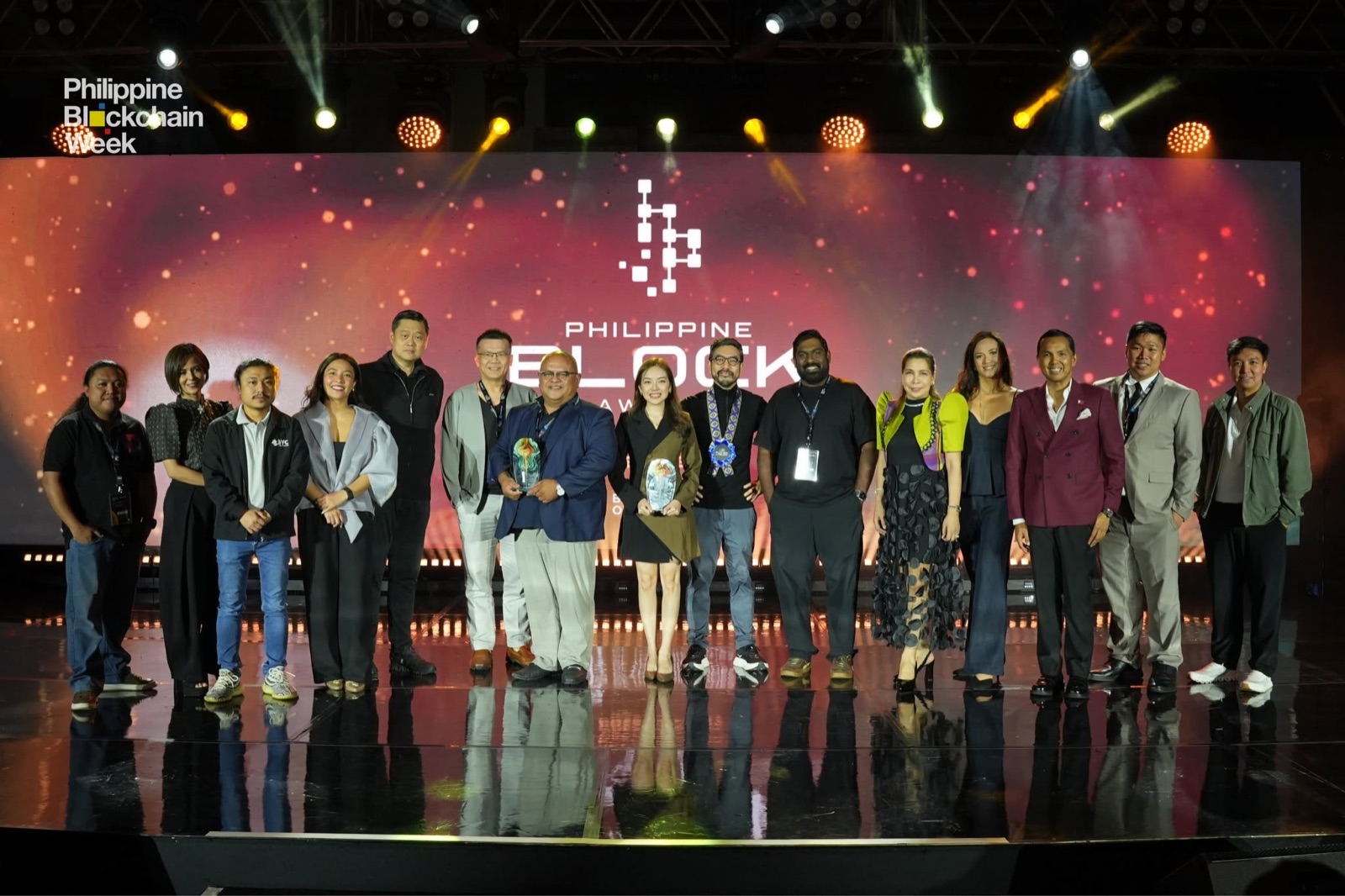 Ferdie James Nervida at Philippine Blockchain Week 2026 after receiving the Outstanding Community Contribution Award